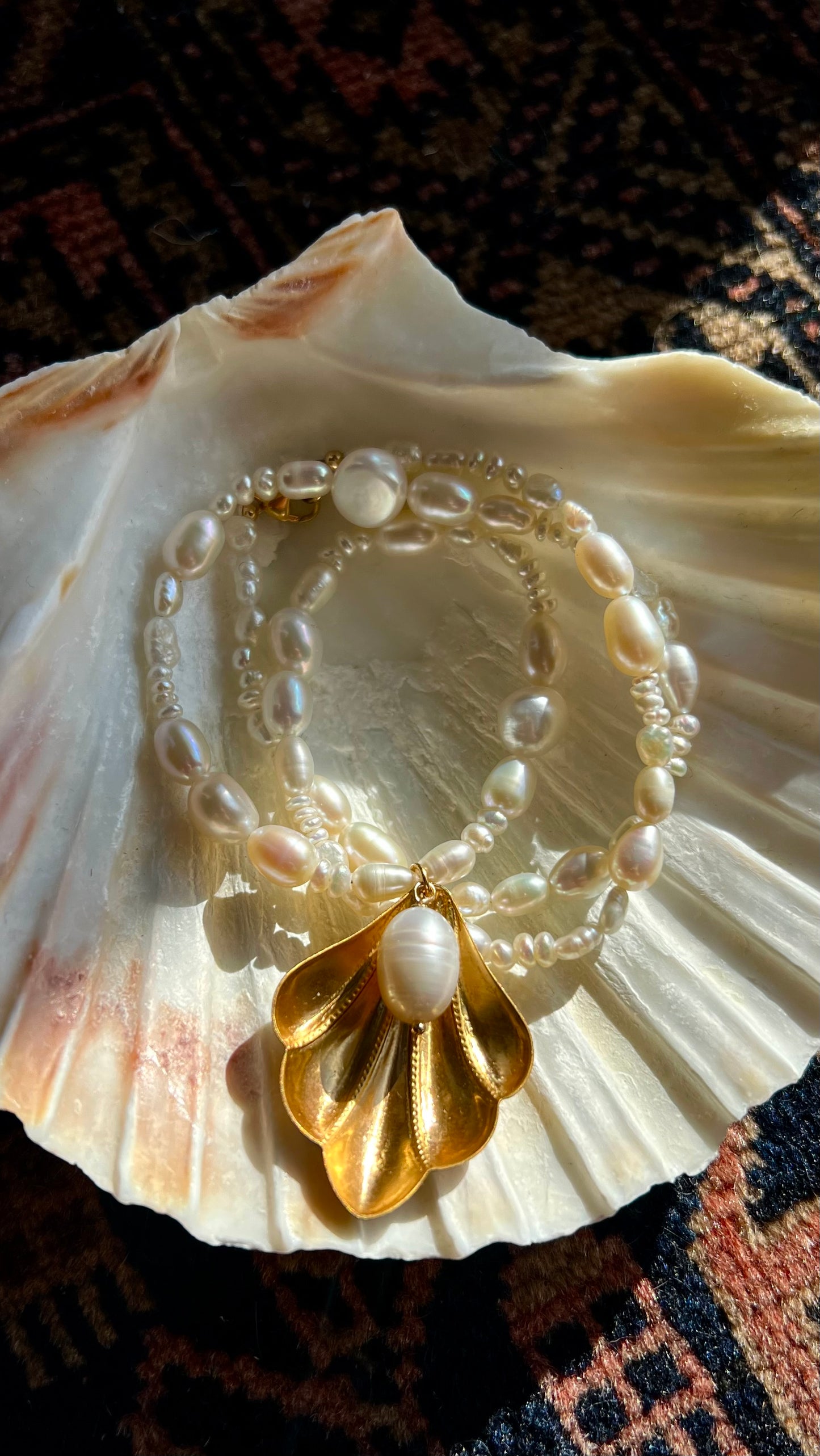 THE WORLD IS YOUR OYSTER NECKLACE